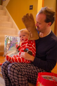 Atticus tries on one of Uncle Chris's new fire building gloves…