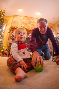 Atticus graciously allows Papa to play with his toys